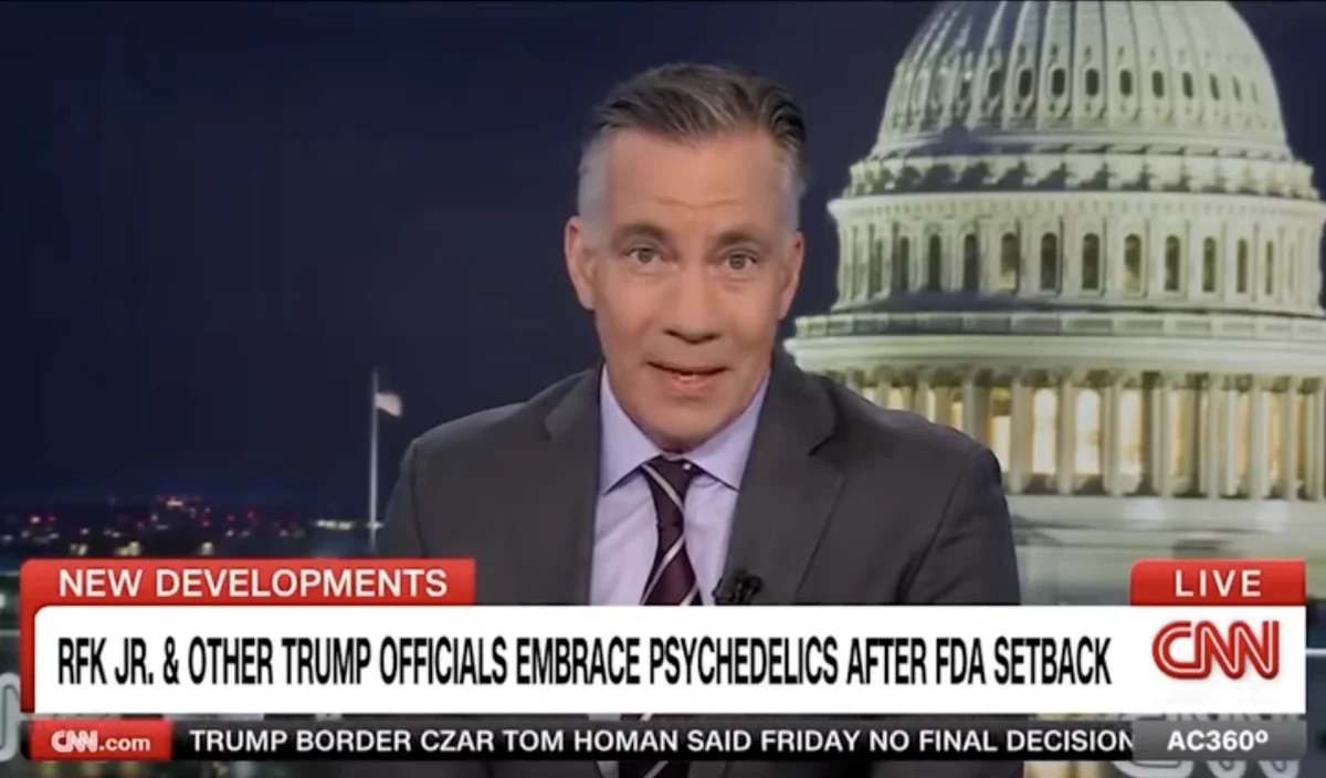 CNN news anchor discusses RFK Jr. and Trump officials' stance on psychedelics, with the Capitol building in the background.