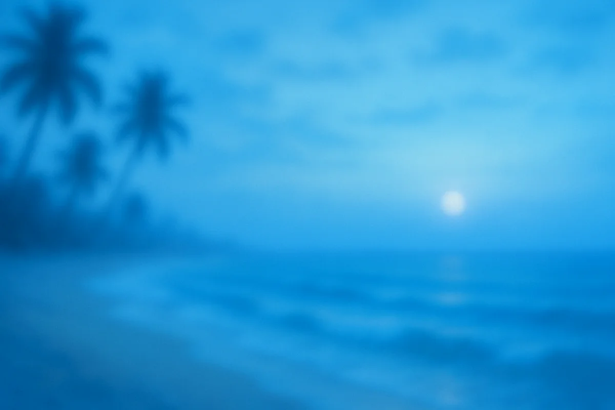 Soft blue hues of a beach at dusk, with silhouettes of palm trees and a glowing moon reflecting on gentle waves.