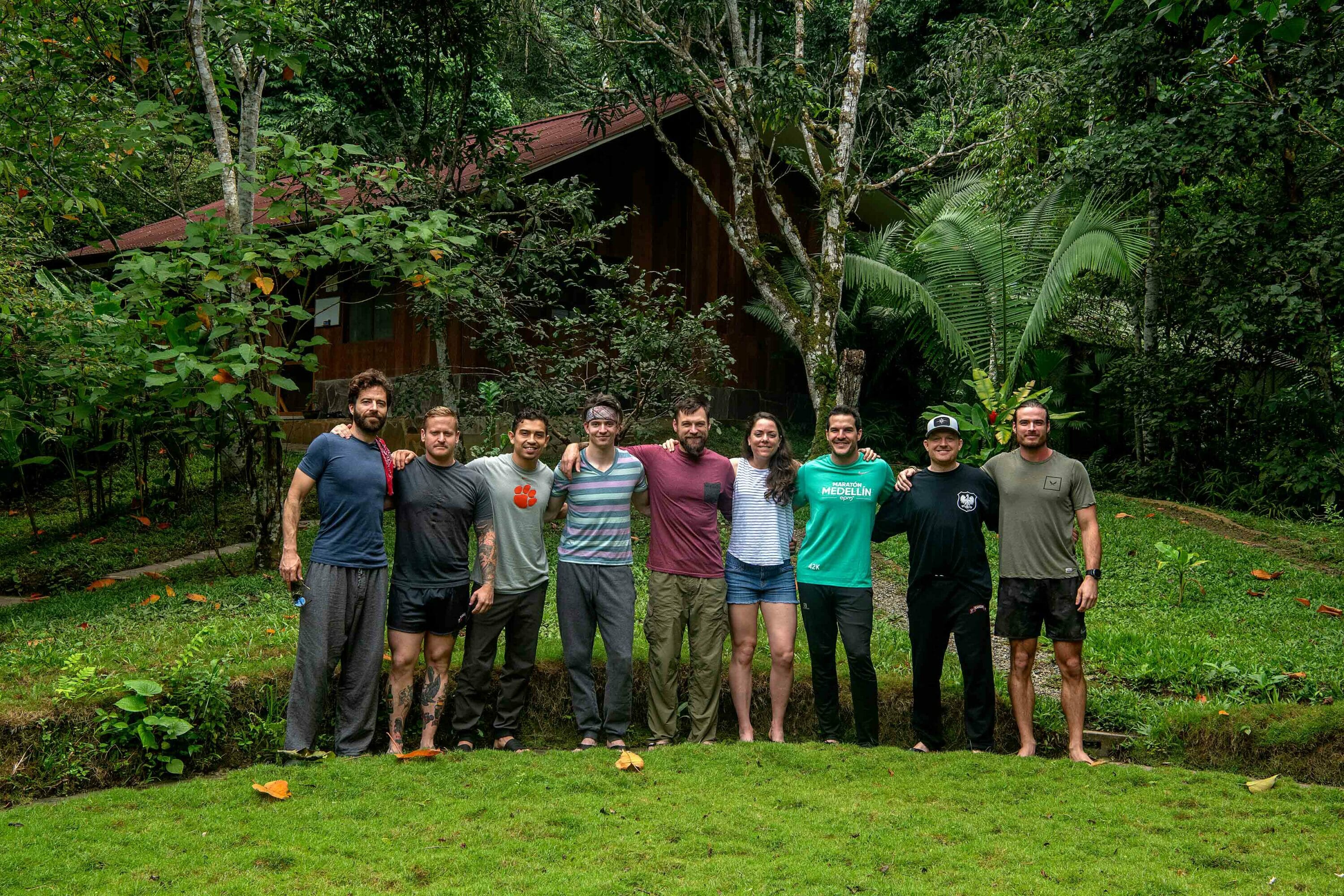 Retreat attendees standing outside with their arms around each other's shoulders